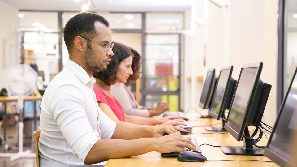 students giving computer based exams